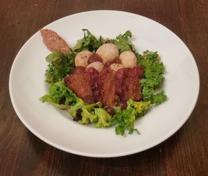 paprika-seitan-sausage on green kale at Vaust Braugaststatte in Berlin