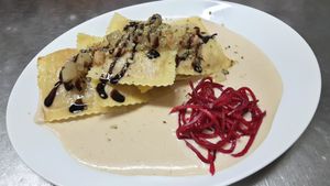 Large Ravioli with filling of pumpkin and potatoes on white bean and horseradish soy cream, pears and peanut salsa, marinated slices of radish
11.11.2017 Main dish of the day at Vaust Braugaststatte in Berlin