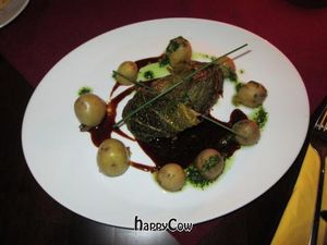 Kohlrabi schnitzel served with a chicory and orange ragout and a green puree at Vaust Braugaststatte in Berlin