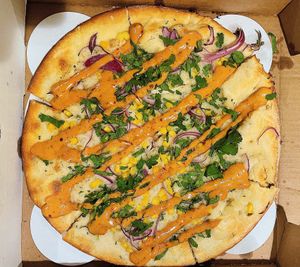 Vegan Elote pizza w/ drizzled spicy chipotle sauce  at Picazzo's Organic Italian Kitchen in Sedona