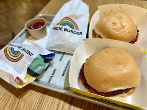 Two burgers and some sides  at Indie Burger in Graz