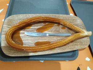 Vegan caramel tofu, knife for size reference at Churrissimo in Zaragoza
