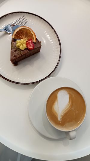 Vegan cheesecake and almond milk coffee at Veggy Delivery in Ankara