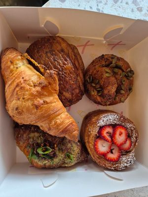 Plain croissant: good; Pain au chocolat: delish; Maple black pepper $9: really good; Strawberry danish $9.50; Garlic bread croissant $10: soft texture, nice chilli oil at Croix Croissant in Flemington