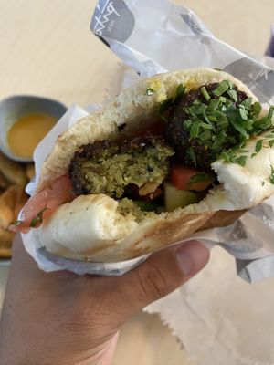 Falafel which kinda tasted store bought. Bread was nice but soaked all the sauce and was wet and sloppy at the end.  at The Pita Man at Selina in St Kilda