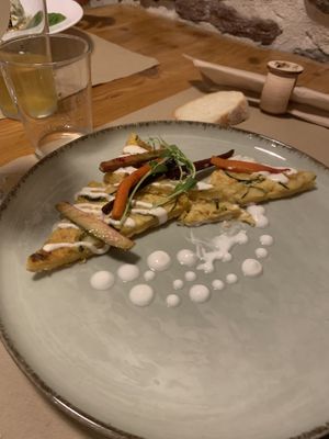 Farinata di verdure (one piece missing cause my mom started eating it)   at L'Aia in Mezzana