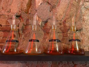 Different grade of spicy oils  at El Vato Loco in Barcelona