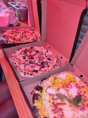 Carbonara, 4 seasons, cheeseburger pizza (right to left) at El Vato Loco in Barcelona