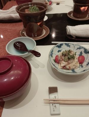 Yuba avocado salad, a soup and a soy meat dish that cooks during the meal. at Umenohana Ginza Namiki Dori-Shop in Tokyo