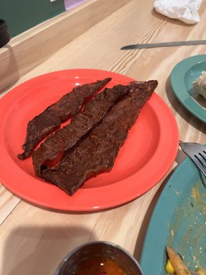 Rice paper bacon (they gave us extra bc they forgot to put it on the burger, so don’t expect to normally get this much)   at devil's lettuce in Richmond