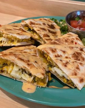Chronic Crab and Egg Quesadilla, with tofu scramble, hearts of palm, Mexican shredded cheese, spicy Cajun remoulade, and pico de gallo at devil's lettuce in Richmond