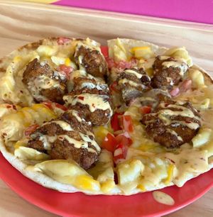 Toasted flatbread, Dank Nuggs, mac and cheese, diced tomatoes, Cajun remoulade at devil's lettuce in Richmond