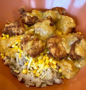 Kentucky Fried Vegan Bowl with mashed potatoes, dank nuggs, Cajun gravy, corn, and shredded cheese at devil's lettuce in Richmond