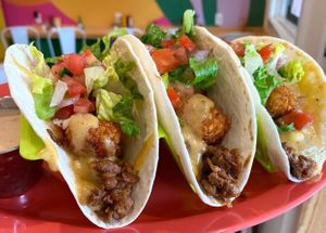 Beef and ‘Tato Tacos with Beyond meat taco meat, tater tots, nacho cheese sauce, pico de gallo, shredded lettuce, and Baja ranch at devil's lettuce in Richmond