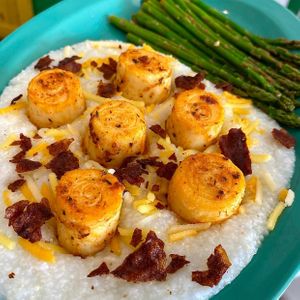 Vegan Blackened Scallops: Hearts of palm seared in browned butter with cheesy grits and lemon garlic asparagus at devil's lettuce in Richmond