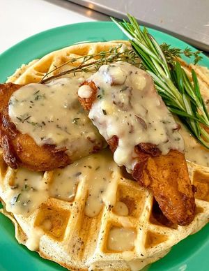 Vegan Chicken Waffle with fried chicken, savory waffle, and maple gravy at devil's lettuce in Richmond