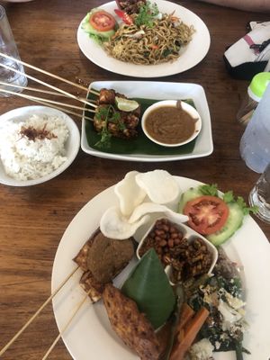 Satay tempeh in the middle, mie goreng at the top and nasi campur at the bottom  at Healthy Warung in Gianyar