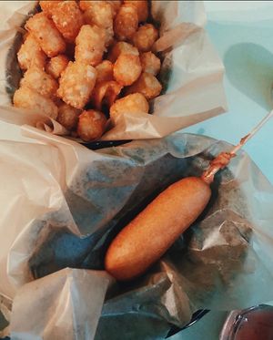 -vegetarian- corn dog on a stick with vegan tater tots at Tattooed Mom in Philadelphia