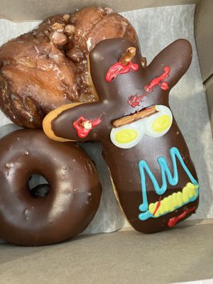 Ridiculous!!!! Apple fritter, voodoo doll, & chocolate raised! Exceptional!!!!!!!!  at DEN - Voodoo Doughnut - Concourse B in Denver