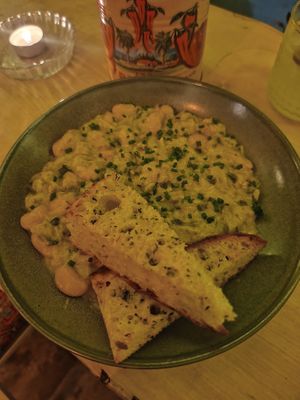 Leak and butter bean Casserole and garlic bread at Nooch Bar and Kitchen in Stirling