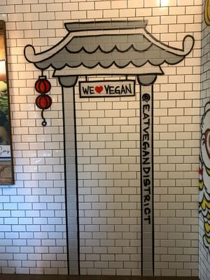 Colorful artwork on restaurant wall at Vegan District Asian Eatery in Loma Linda