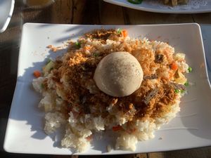 Pineapple fried rice with topped with vegan poached egg on top at Vegan District Asian Eatery in Loma Linda