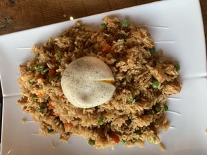 Chicken fried rice with vegan poached egg on top  at Vegan District Asian Eatery in Loma Linda