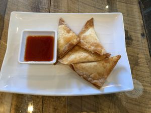 Vegan cream cheese wontons with sauce  at Vegan District Asian Eatery in Loma Linda