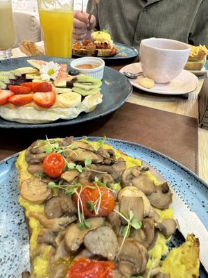 Avocado Toast with Mushrooms and Sweet Waffle (Hondy on the side)   at Nusa Café in Rio De Janeiro