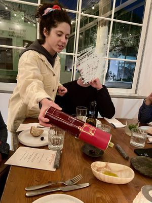 Thalia was our oil sommelier and the one she was pouring was my favorite!! Grassy.  at Panigyri Festival Food in Santorini