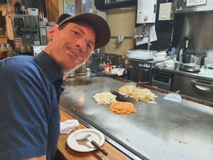 Waiting for 2 vegan Okonomiyaki. One with spicy ramen, one with udon. at Jirokichi - / 次郎吉 in Hiroshima