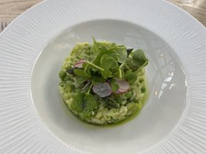 Risotto with fresh asparagus, garden peas, and broad beans. Creamy and flavorful.    at The Manor House Hotel in Moreton-in-marsh
