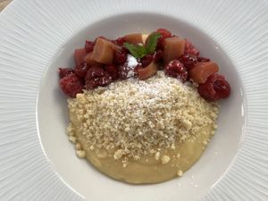 Fabulous custardy dessert with great fruit and crunch nut topping    at The Manor House Hotel in Moreton-in-marsh