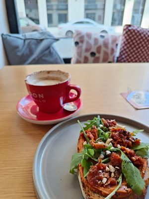 Oat cappuccino and toast with hummus and tomato at Lulat - Maybe closed in Valencia