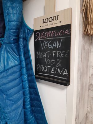Some signs offering vegan options for camperos at Granjero Busca Campero in Madrid