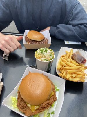 vegan chicken burgers, mac and cheese and chips with bbq sauce at V Rev Vegan Diner in Manchester