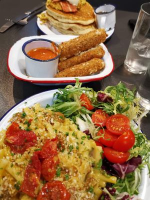 Pancakes, mozzarella sticks, macaroni and cheese, and salad. at V Rev Vegan Diner in Manchester