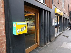 Outside V-Rev at V Rev Vegan Diner in Manchester