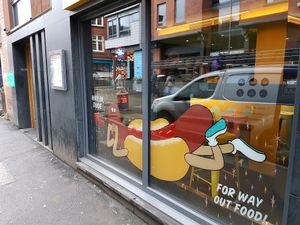 Outside V-Rev at V Rev Vegan Diner in Manchester