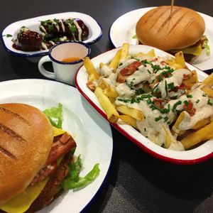 Burgers loaded fries and chicken at V Rev Vegan Diner in Manchester