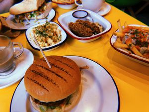 Burger, mozzarella sticks, loaded fries, mac and cheese! at V Rev Vegan Diner in Manchester