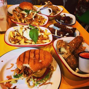 Whopper Way to Make a Living and Southwest of Heaven burgers. Mozzarella sticks, chicken tenders and pesto fries.  at V Rev Vegan Diner in Manchester