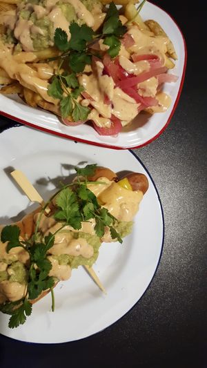 Hot dog and loaded fries at V Rev Vegan Diner in Manchester