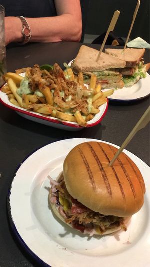 Chicken sandwich, loaded pesto fries and bbq beef burger at V Rev Vegan Diner in Manchester