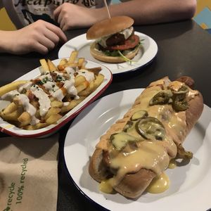 dirty fries, hot dog, and a burger  at V Rev Vegan Diner in Manchester