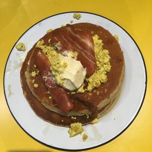 “Savoury pancakes” - bacon, butter, tofu scramble and maple syrup. at V Rev Vegan Diner in Manchester