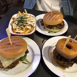 Buffalo loaded fries (top left), ‘Kevin bacon’ burgers and ‘donut stop me now’ (bottom right) at V Rev Vegan Diner in Manchester