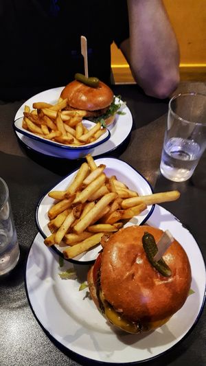 Vegan burgers with chips. at V Rev Vegan Diner in Manchester