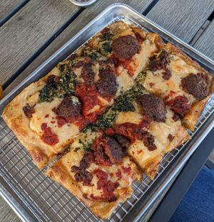 Build your own 4 square with vegan cheese, vegan sausage, and both red and pesto sauce stripes at R Town Pizza in Reno