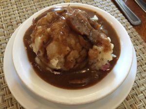 mashed potatoes in a brown mushroom gravy at Detroit Vegan Soul - East in Detroit